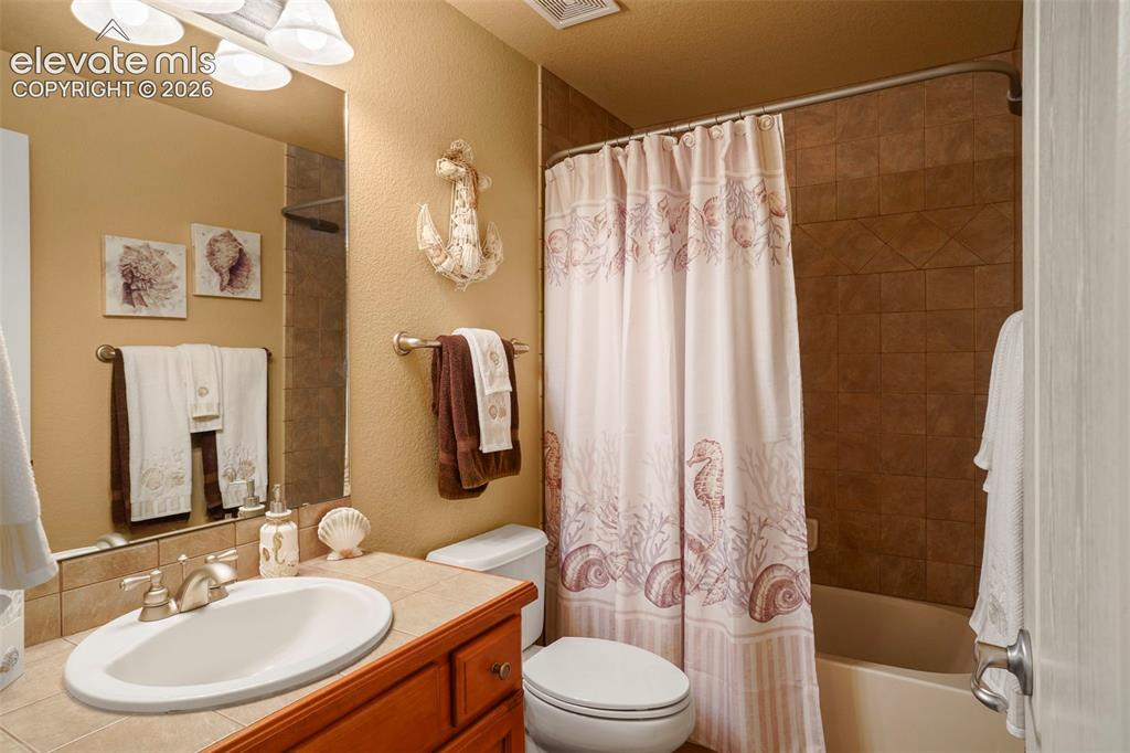 Image 30 of 36: Full Hall Bath in Basement