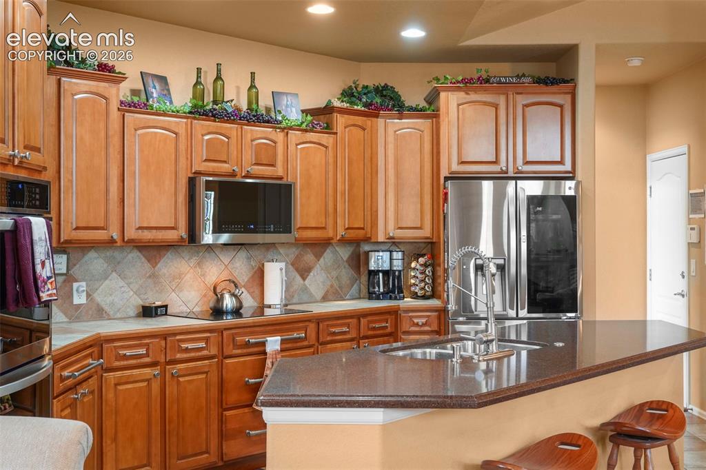 Image 5 of 36: Large island workspace with counter bar