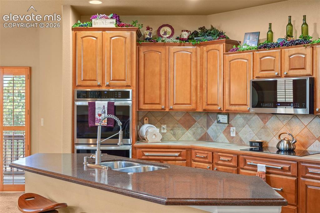 Image 6 of 36: Tiered cabinetry for an elegant feel