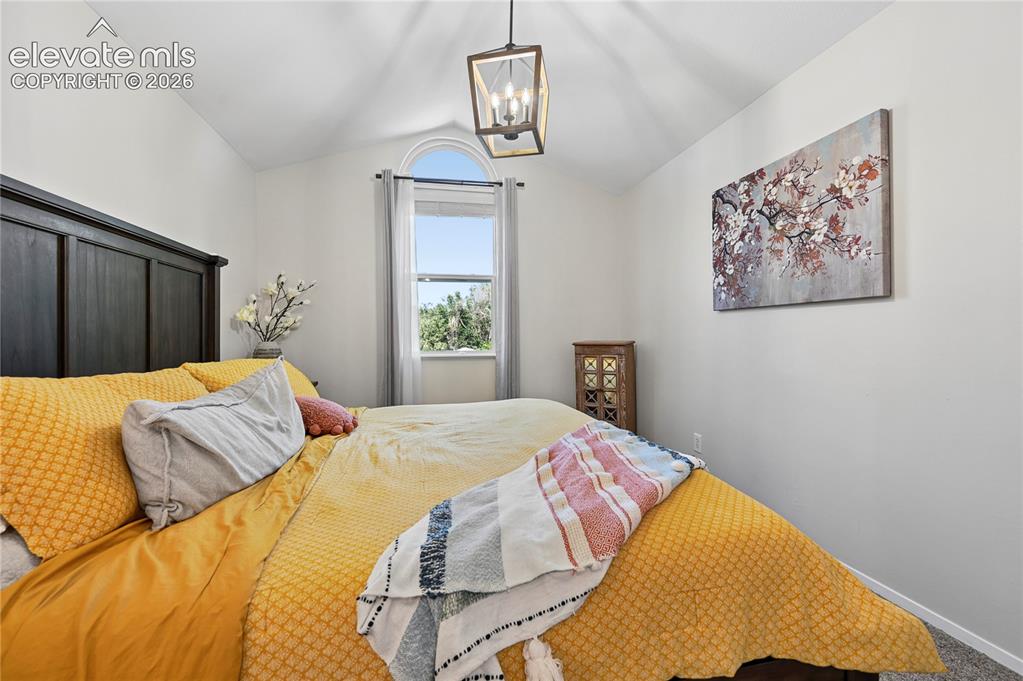Image 19 of 48: Primary Bedroom with Vaulted Ceiling
