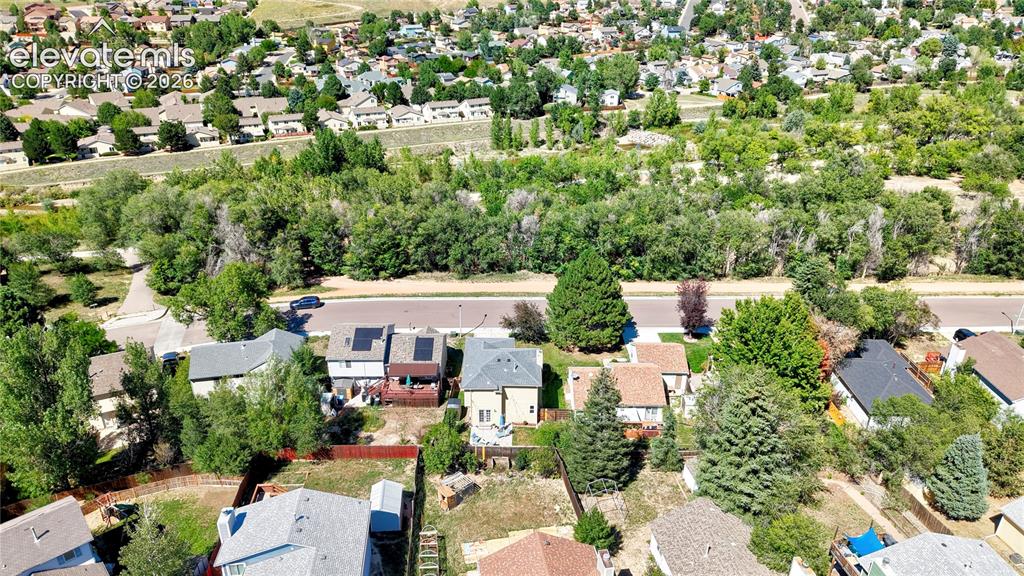 Image 35 of 48: Aerial View of the back of the home and surrounding area
