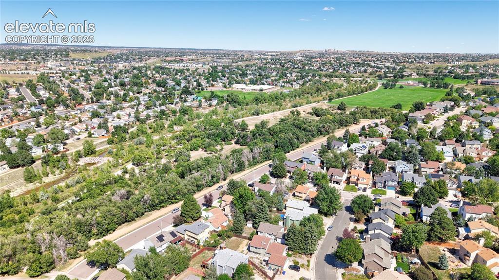 Image 37 of 48: Aerial View of home with Cottonwood Creek Park and Trail across the street