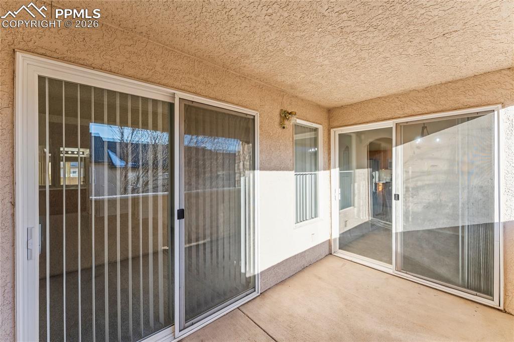 Image 21 of 28: Patio access from primary bedroom and dinning room