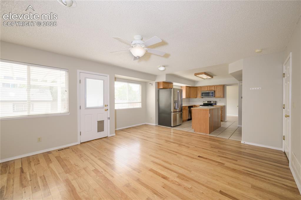 Image 5 of 36: Family room w/ backyard access
