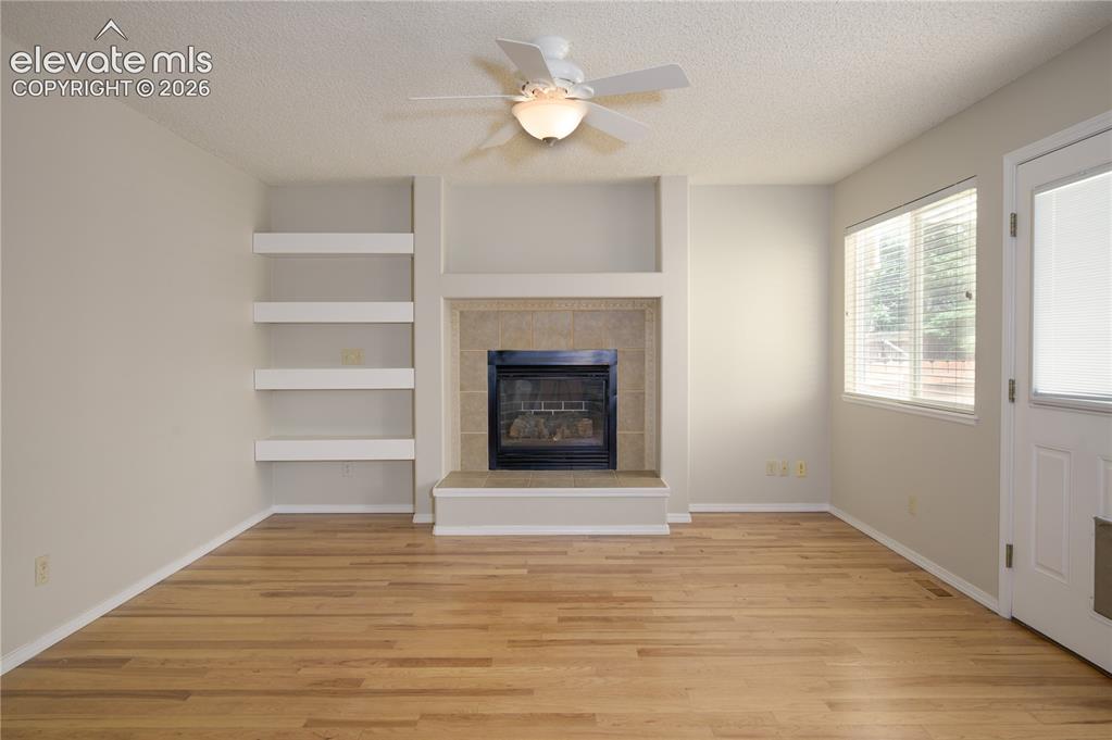 Image 8 of 36: Family room w/ builtins