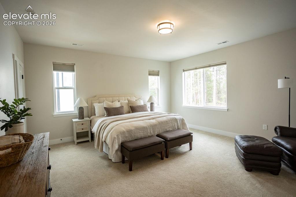 Image 19 of 42: Primary Bedroom Suite with his/her walk-in closets