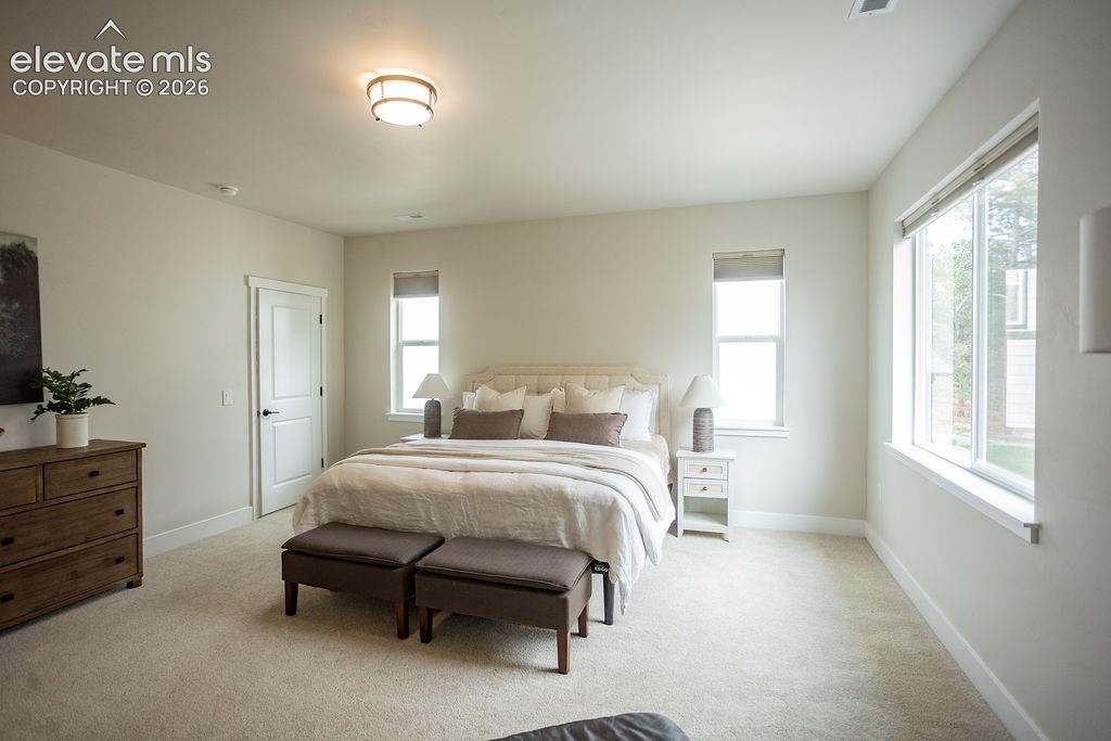 Image 20 of 42: Primary Bedroom Suite with his/her walk-in closets