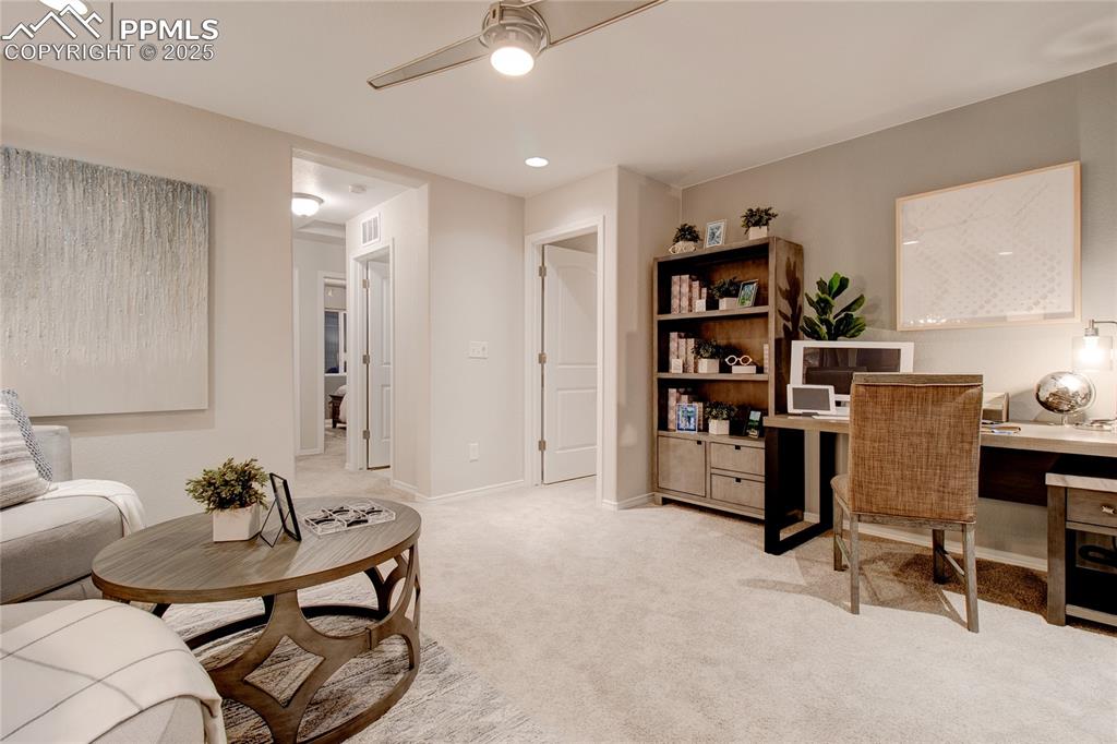 Image 16 of 28: Home office featuring light carpet, a ceiling fan, and recessed lighting