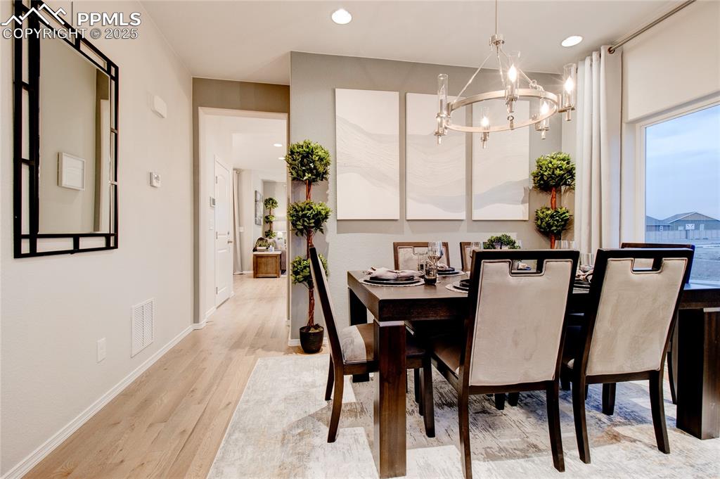 Image 5 of 28: Dining area featuring recessed lighting, light wood-style floors, and a cha