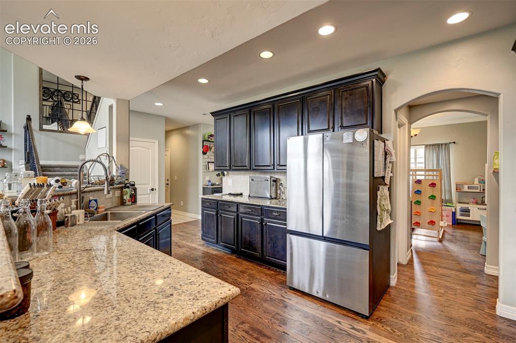 Image 12 of 49: Kitchen, looking toward the formal dining room