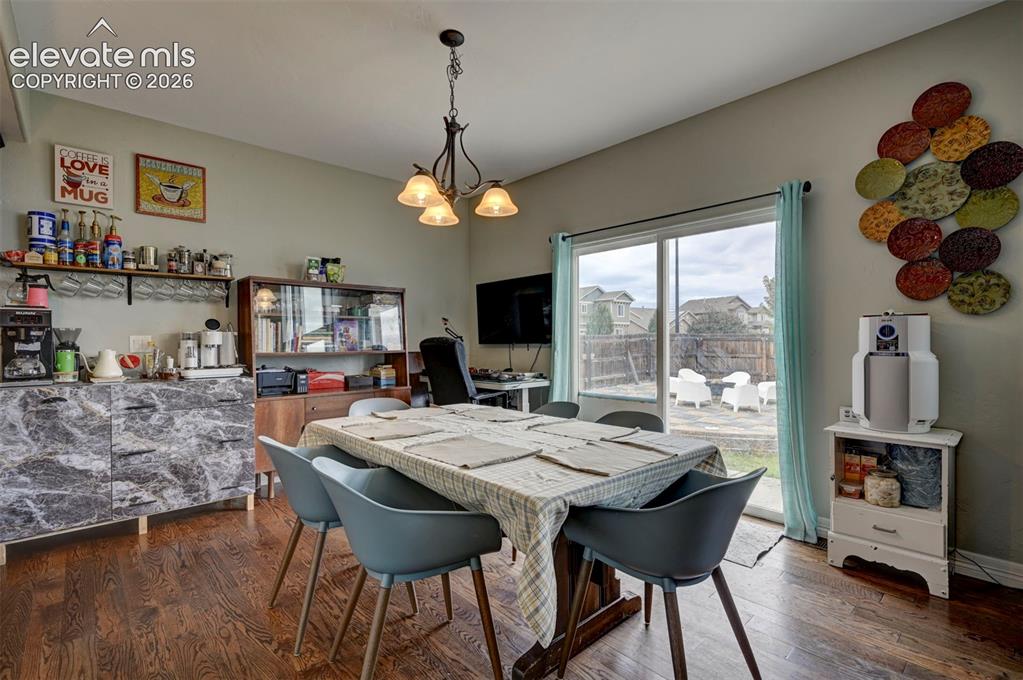 Image 13 of 49: Breakfast nook with slider to the patio