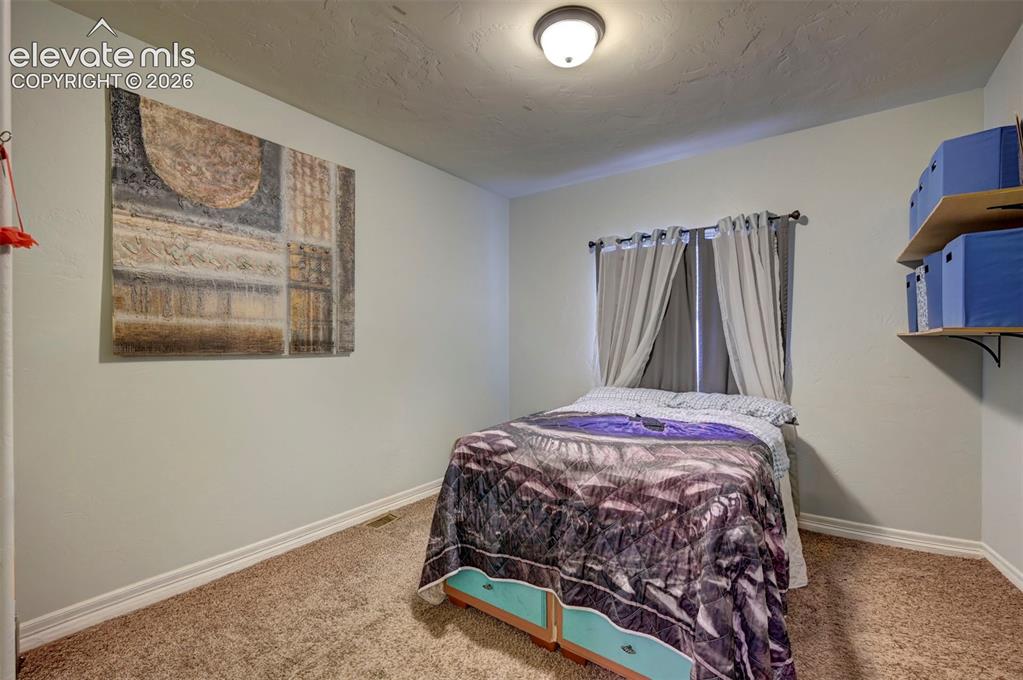 Image 20 of 49: Main-floor bedroom