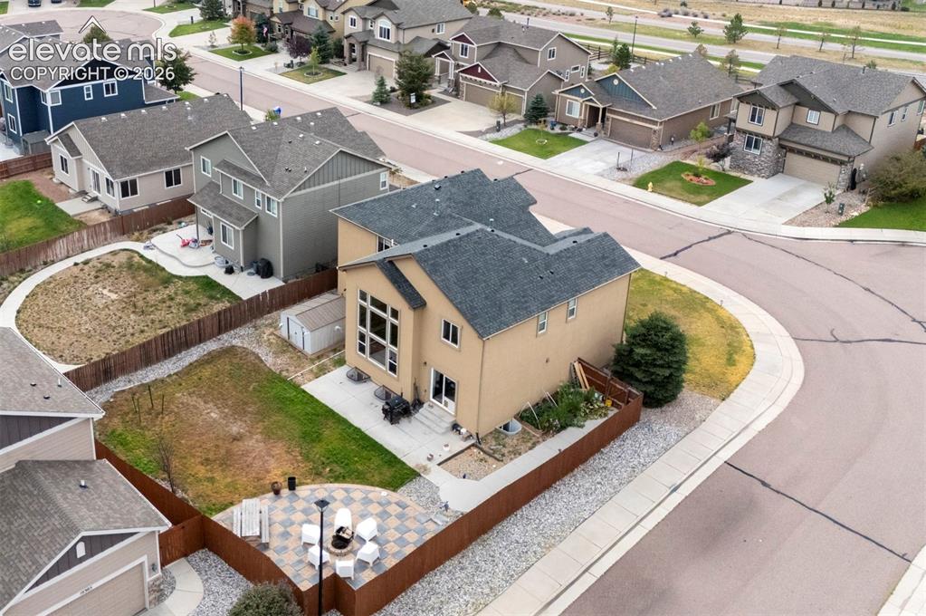 Image 44 of 49: Aerial view of the home and corner lot
