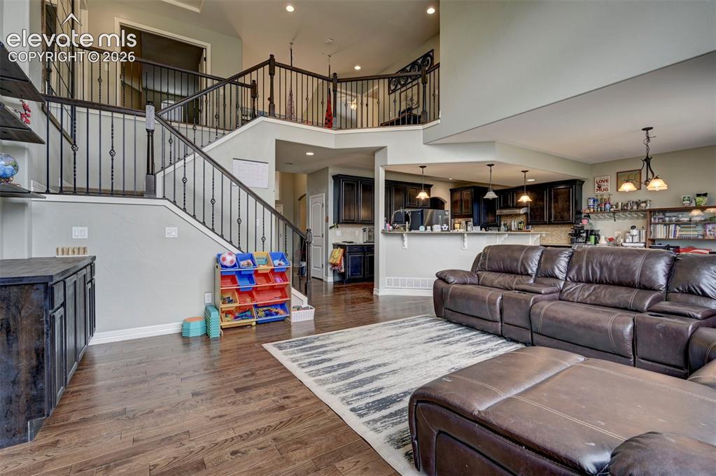 Image 5 of 49: Two-story great room with gas fireplace and built-ins
