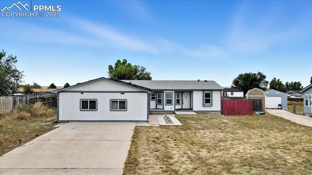 Image 2 of 45: Ranch-style home with driveway