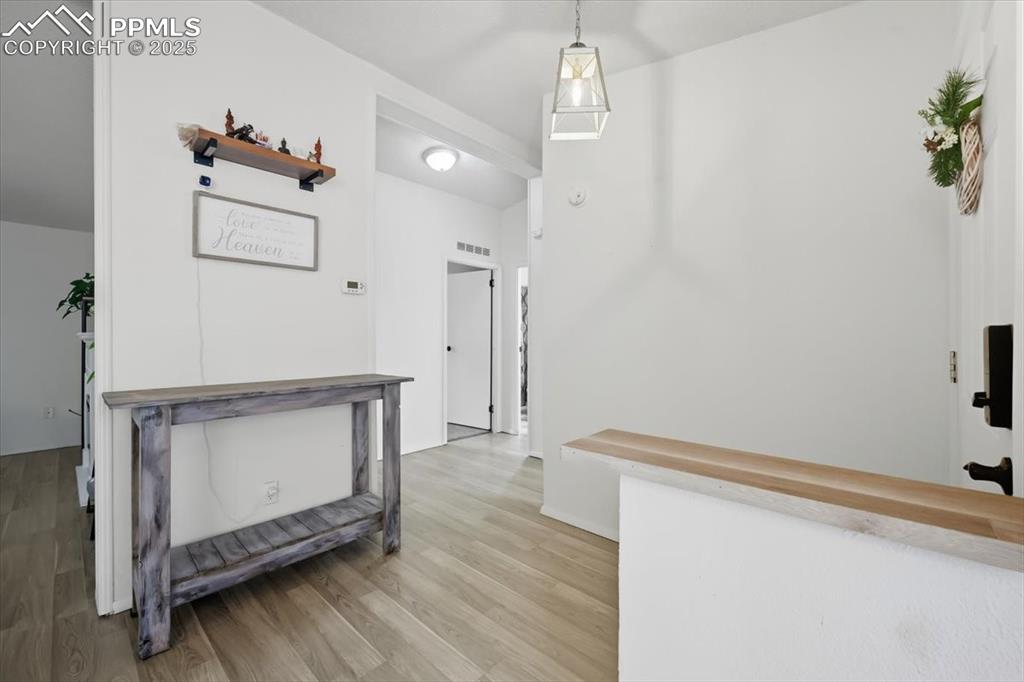 Image 9 of 45: Hall featuring light wood-style floors