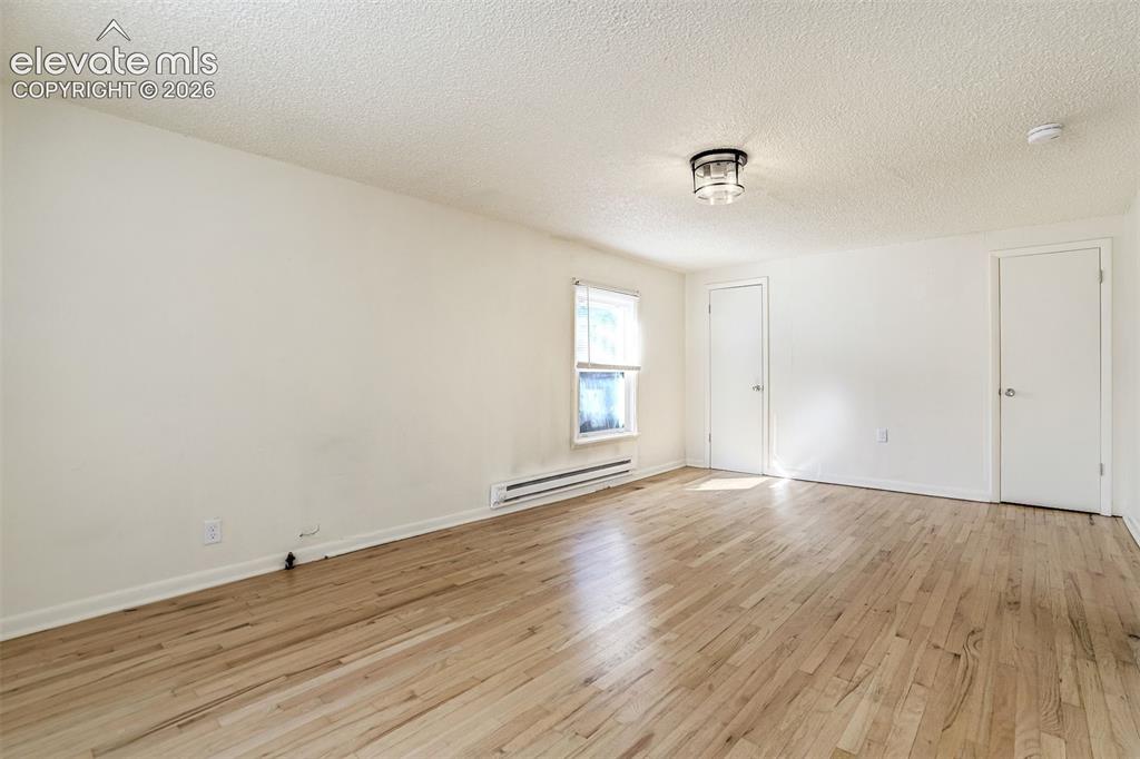 Image 38 of 50: Interior space featuring wood-finish flooring, a flush-mount ceiling light 