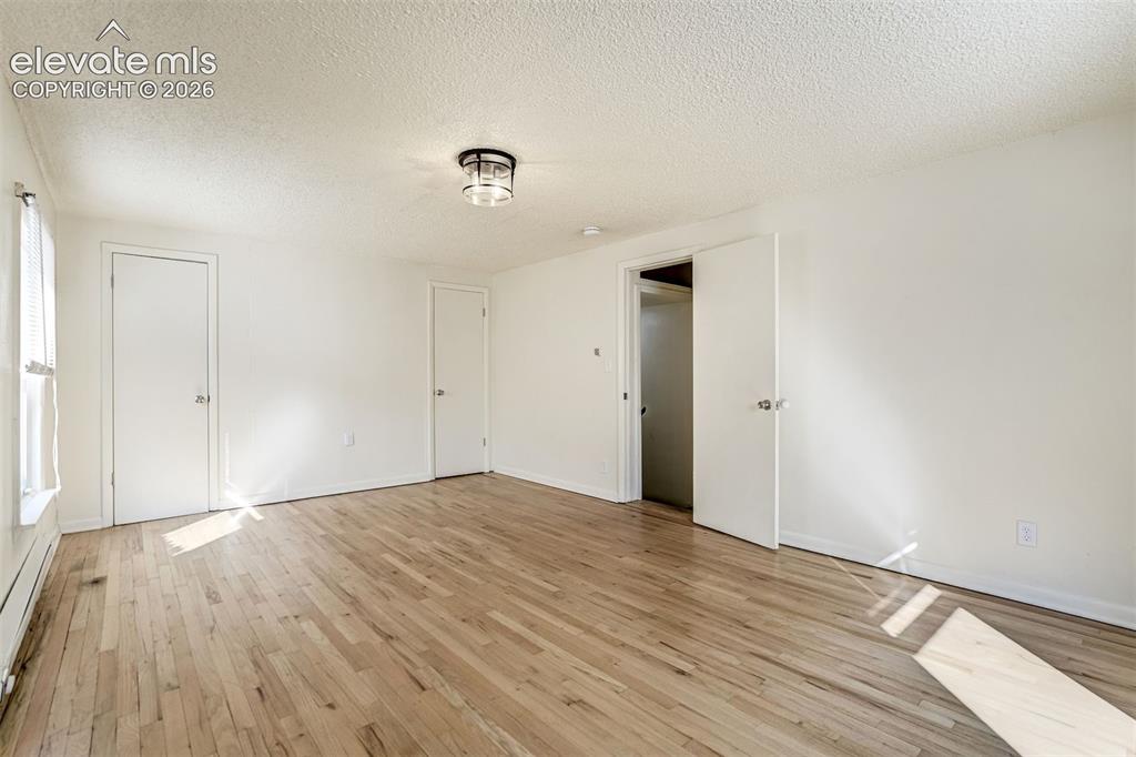 Image 39 of 50: Interior space featuring wood-finish flooring, a flush-mount ceiling light