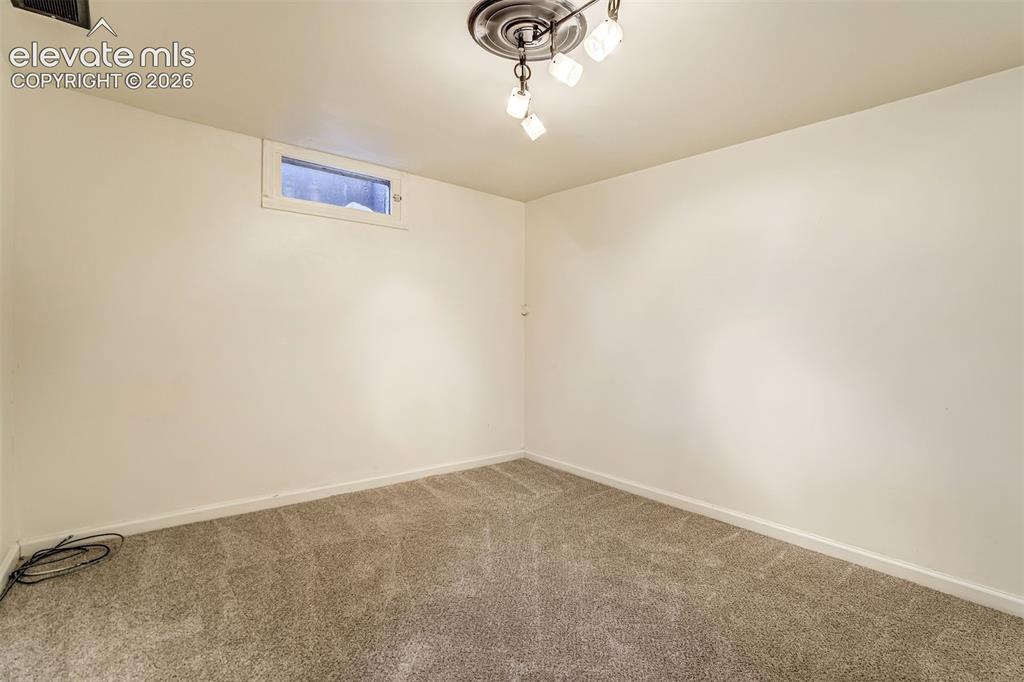 Image 43 of 50: Neutral-toned carpeting, high-gloss finished walls, horizontal rectangular 