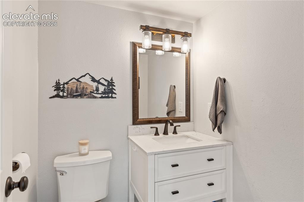 Image 21 of 46: Main level half bath