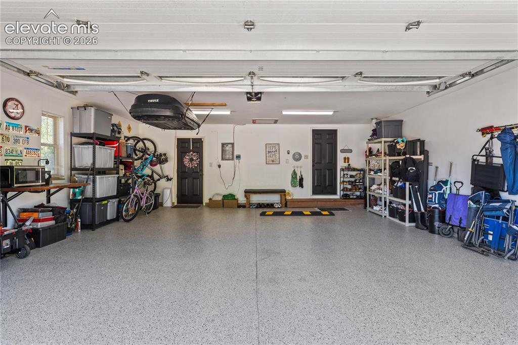 Image 36 of 46: New polyurea floor in garage.