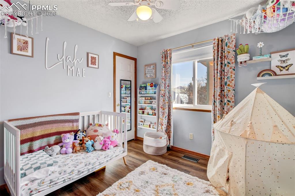 Image 13 of 35: Second upper level bedroom great for family, guests or a home office space