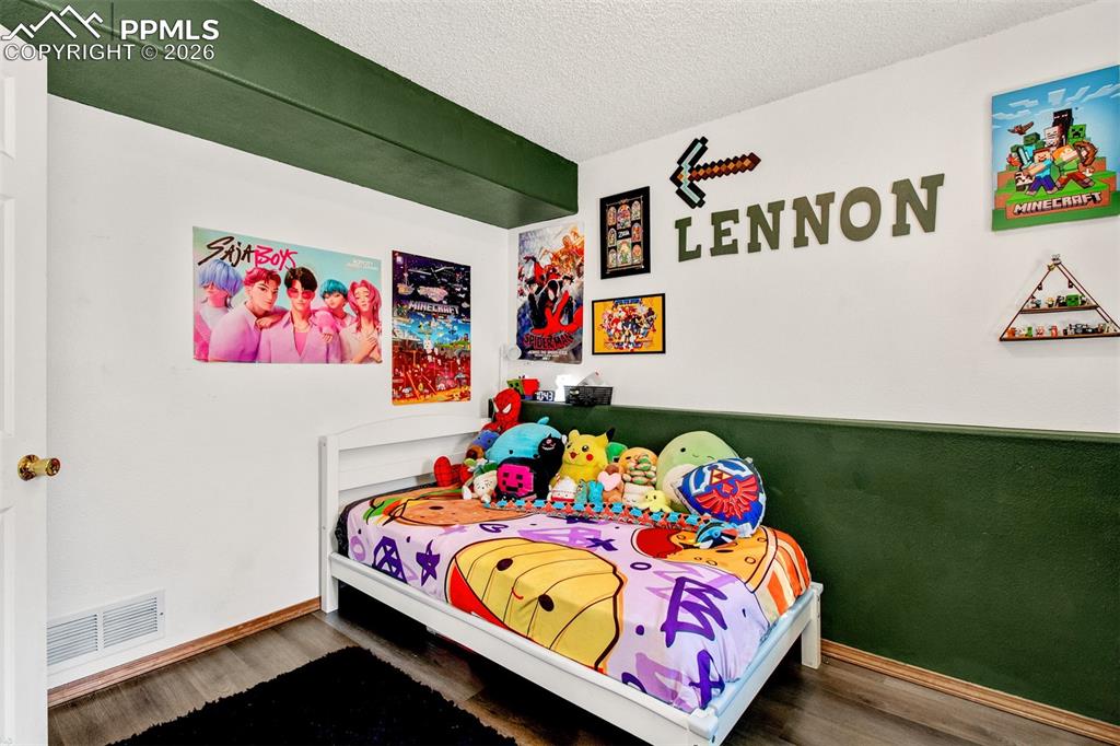 Image 20 of 35: Lower level bedroom