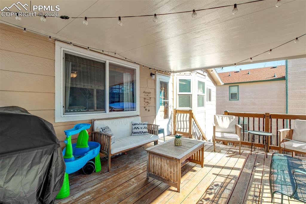 Image 23 of 35: The wood deck offers a great amount of space for seating to enjoy the outdo