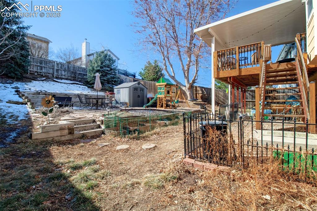 Image 27 of 35: This backyard has different tier levels allowing it to be segmented into un