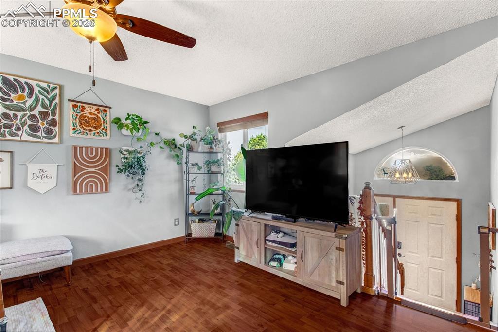 Image 3 of 35: Vaulted ceiling entry leads up to the bright living room