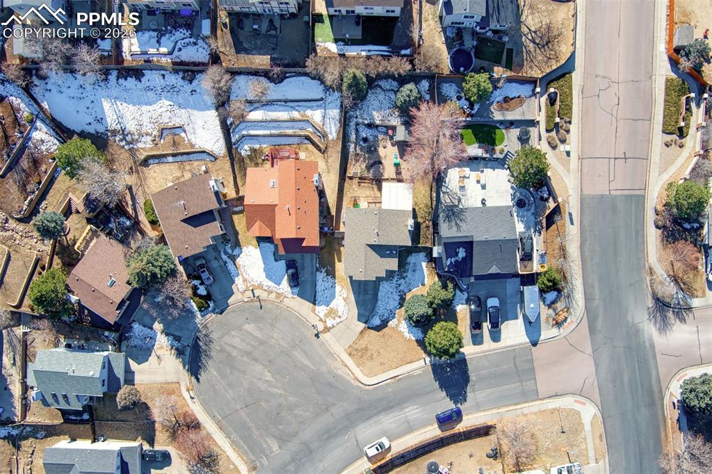 Image 31 of 35: Aerial view showing the larger angled backyard space