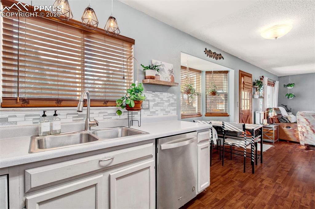 Image 9 of 35: Double stainless steel sink with disposal and built-in faucet sprayer