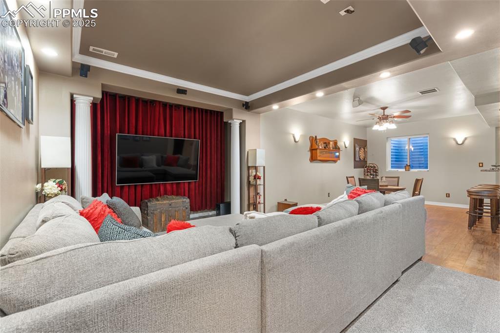 Image 23 of 41: Living room with ornamental molding, recessed lighting, a ceiling fan, and 