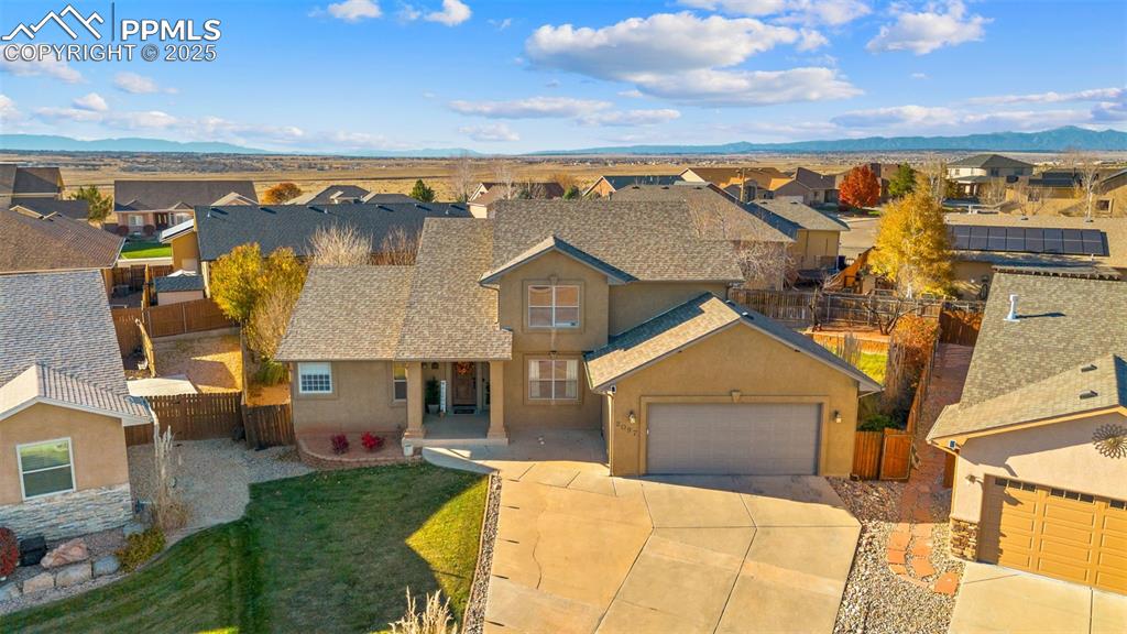 Image 35 of 41: View of front of home featuring a residential view, stucco siding, concrete