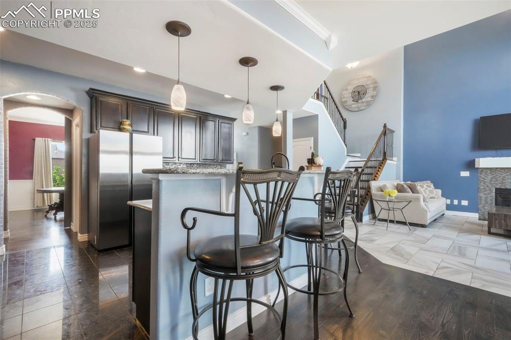 Image 11 of 50: Kitchen with granite counters, stainless steel appliances, large walk in pa