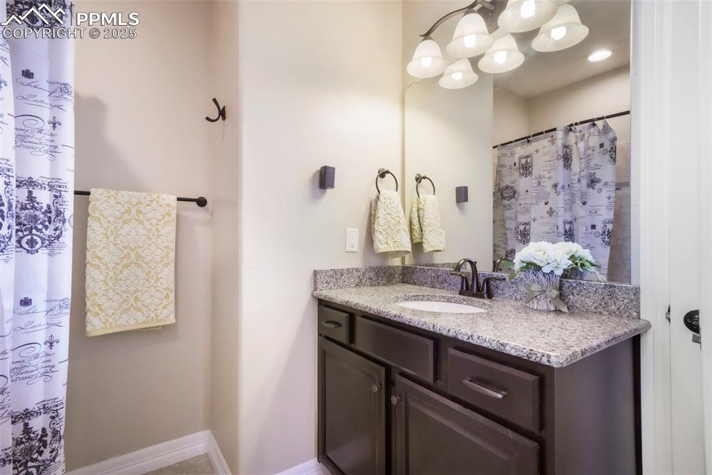 Image 13 of 50: Main level Full bathroom