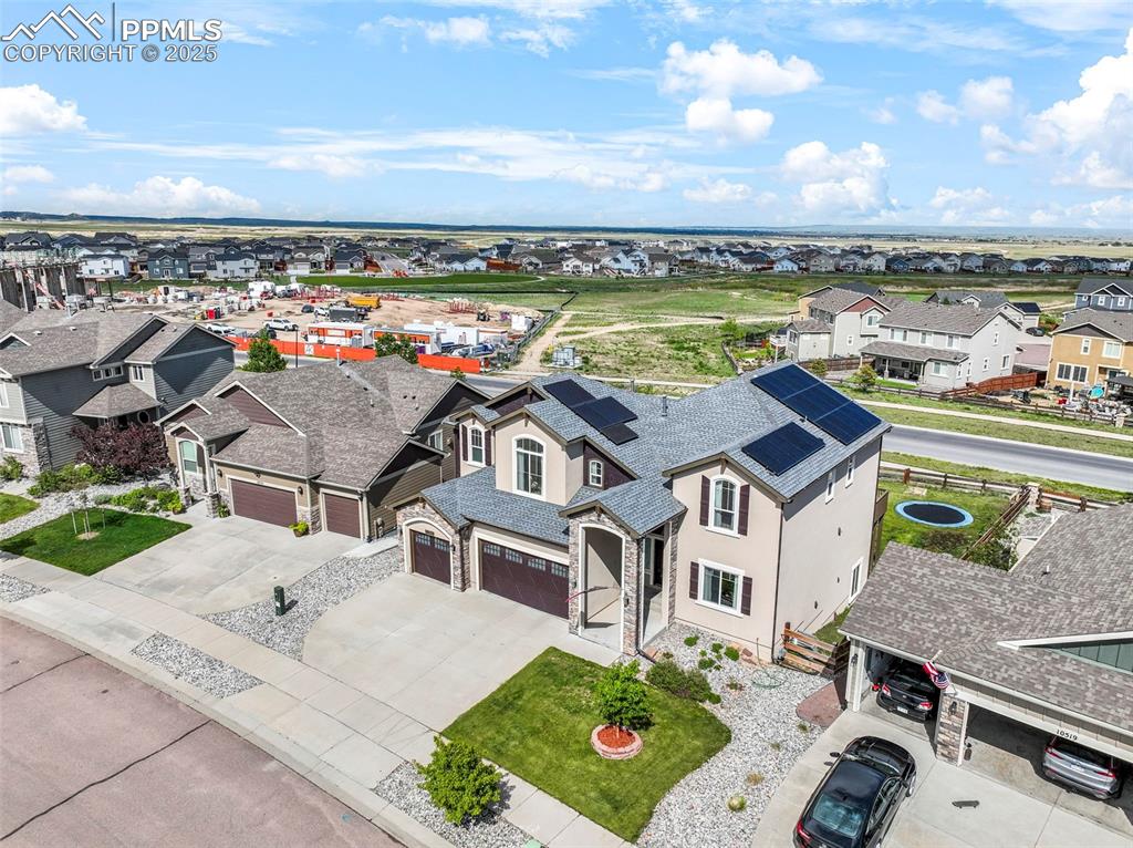 Image 2 of 50: Aerial view of front of home