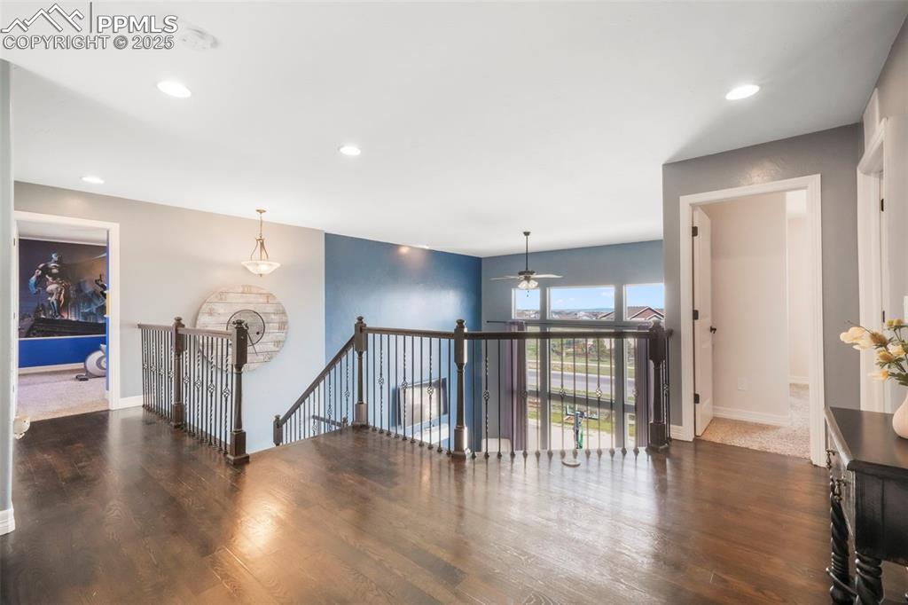 Image 20 of 50: Upper level walkway to bedroom, bathroom and laundry access