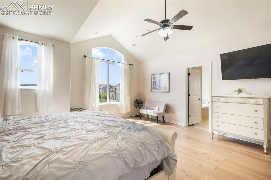 Image 21 of 50: Upper level primary bedroom with 5 piece bathroom and large walk in closet