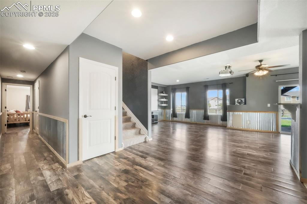 Image 34 of 50: Basement level family room, walk out patio access and wet bar