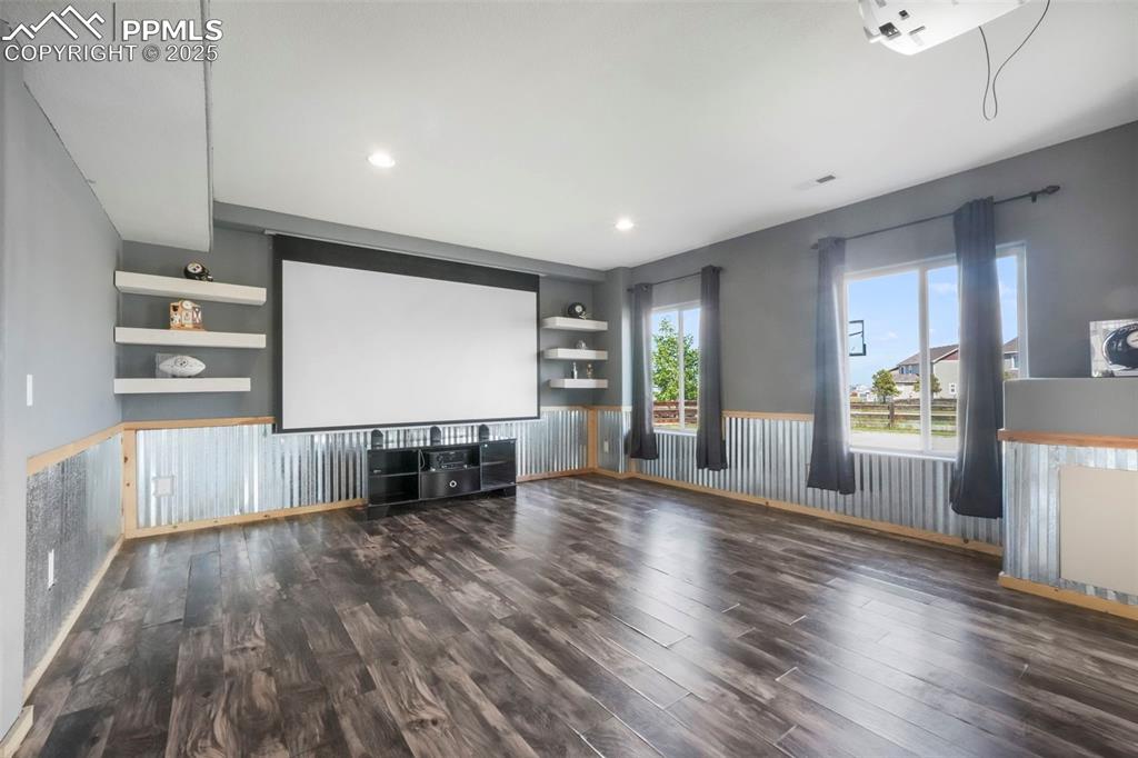 Image 35 of 50: Basement level family room, walk out patio access and wet bar
