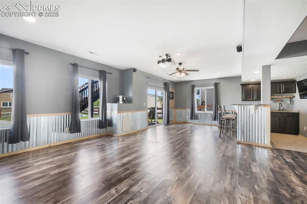 Image 36 of 50: Basement level family room, walk out patio access and wet bar
