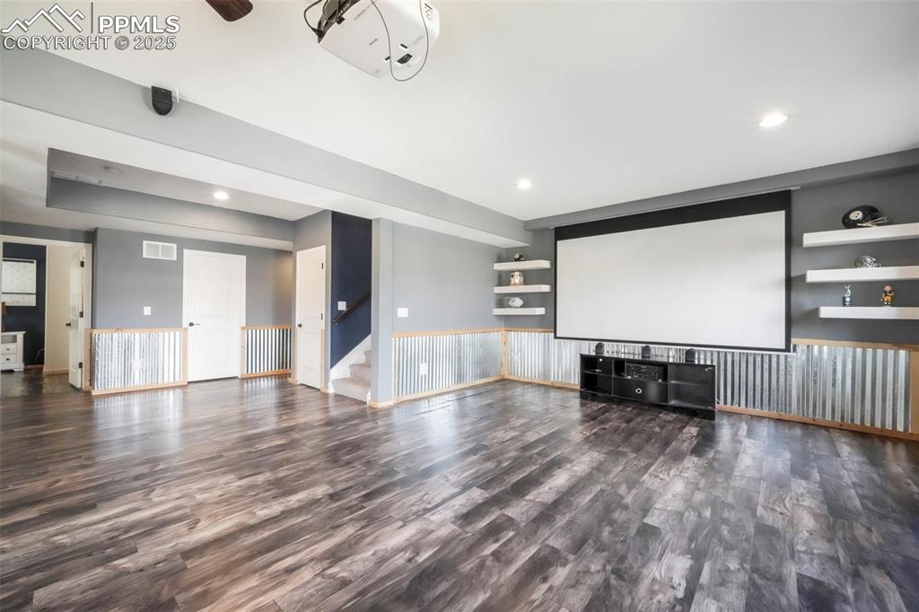 Image 37 of 50: Basement level family room, walk out patio access and wet bar