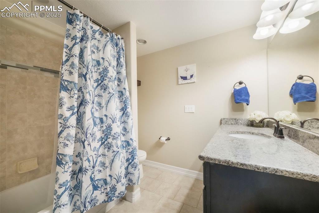 Image 40 of 50: Basement level full bathroom