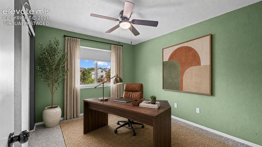 Image 29 of 50: 4th upper level bedroom virtually staged as an office