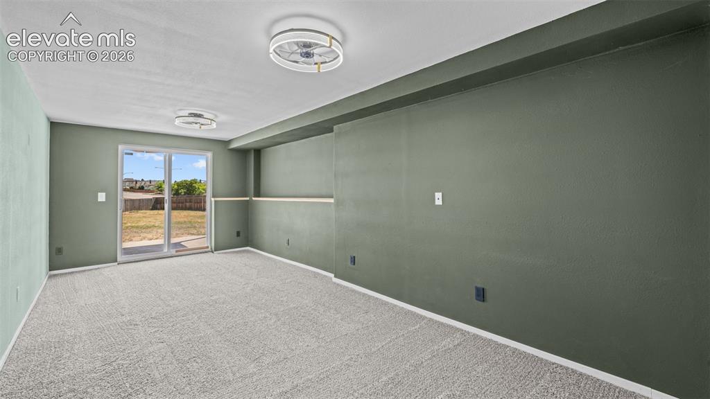 Image 31 of 50: 2nd family room in the basement with walk out to back yard