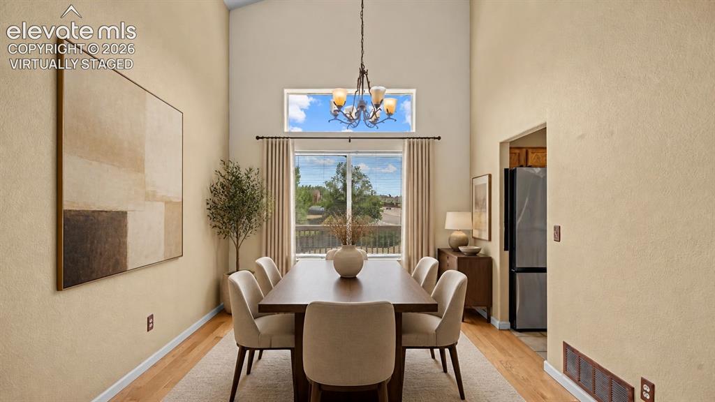 Image 6 of 50: with vaulted ceiling. Virtually staged