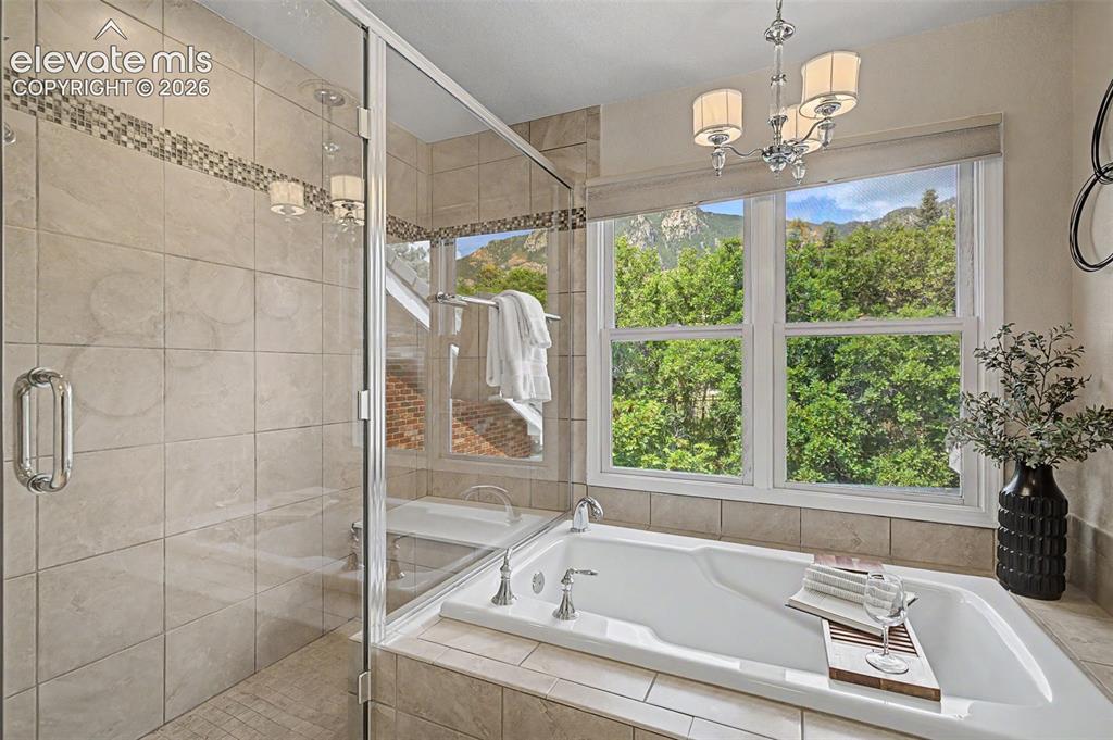 Image 32 of 50: Tub with stand alone shower