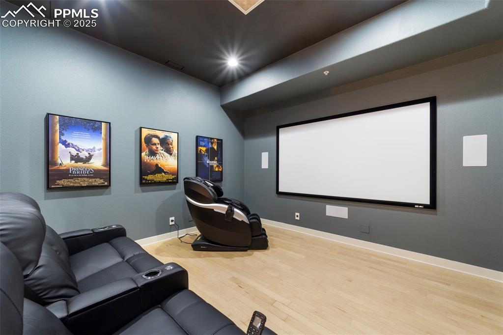 Image 14 of 40: Theater room featuring hardwood floors and recessed lighting. All equipment