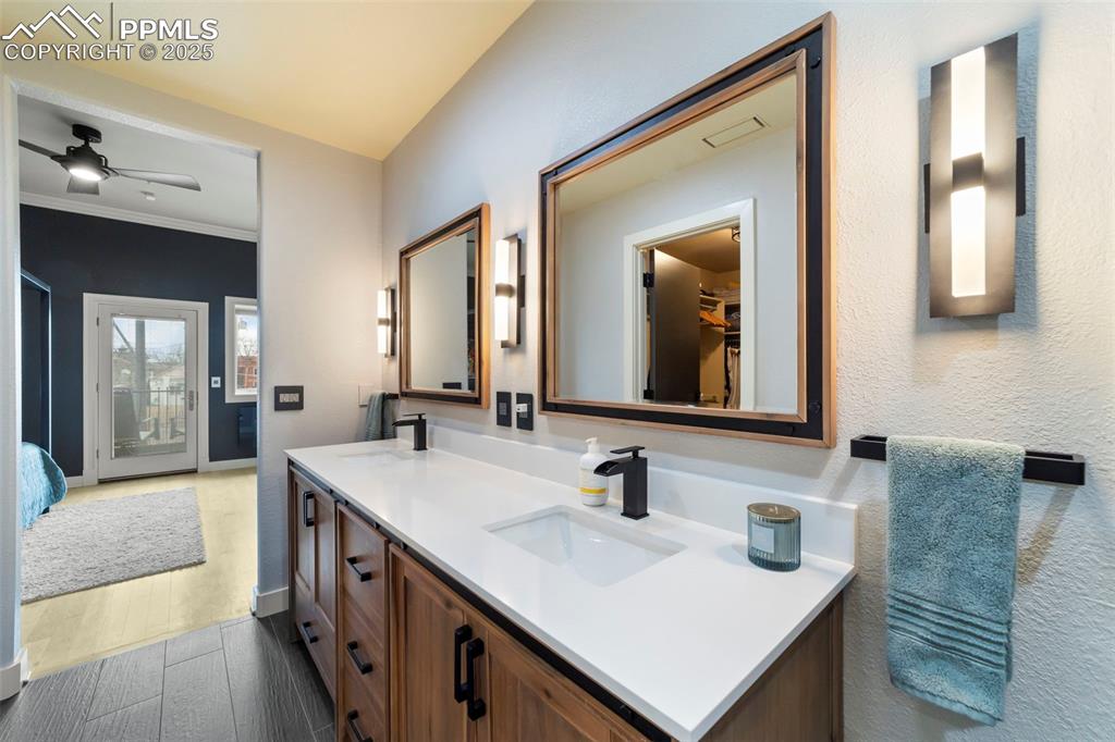 Image 22 of 40: Primary Full bath just renovated and featuring a spacious walk-in closet, a